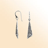 Handcrafted sterling silver long triangle drop earrings with Balinese scrollwork and oxidized detailing